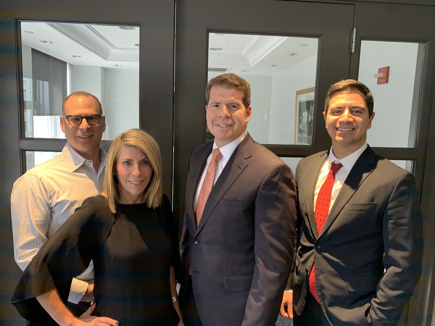 From left to right: Douglas R. Hirsch (Partner), Jennifer Rossan (Partner), Sam Lieberman (Partner), and James Ancone (Partner)